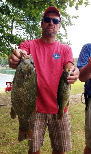 Anthony with 5lb Small mouth.jpg