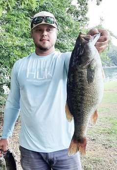 Wyatt with 6.56 lb spotted bass.jpg